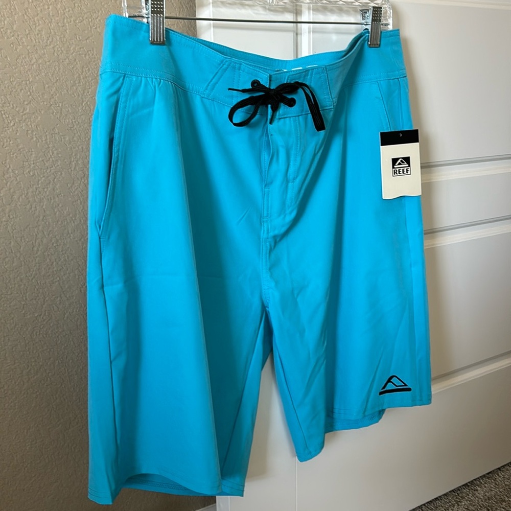 NWT Men’s Reef board shorts. Waist size 34.